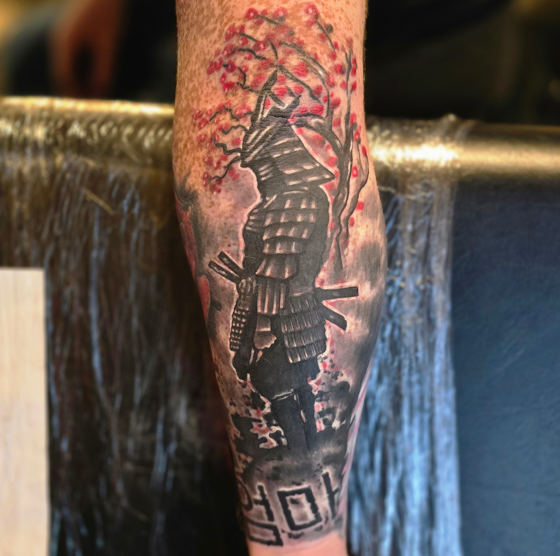 Man tattooing with gloves medium shot